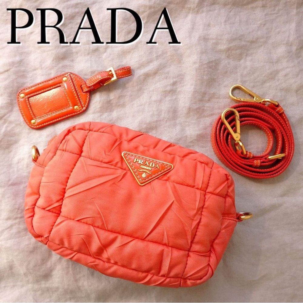 Prada Tessuto or Re-Nylon quilted crossbody bag in an orange saumon color